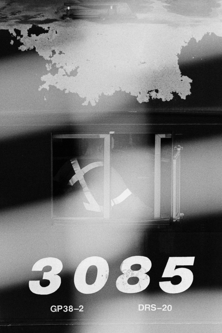 Detail of the cockpit of a diesel engine with worker.